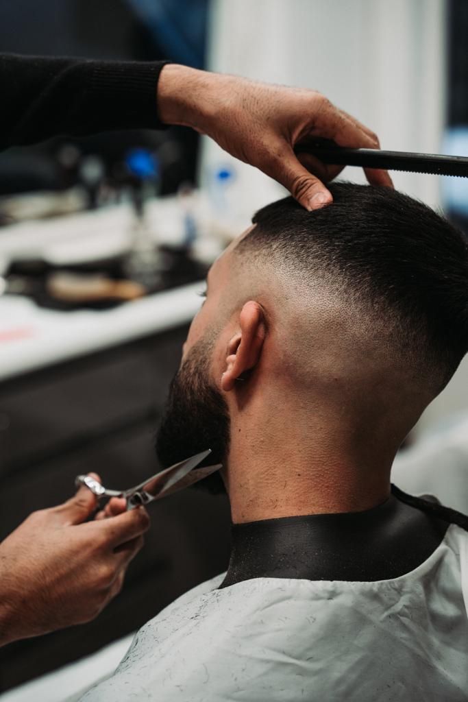 A close, considered cut with scissors and comb